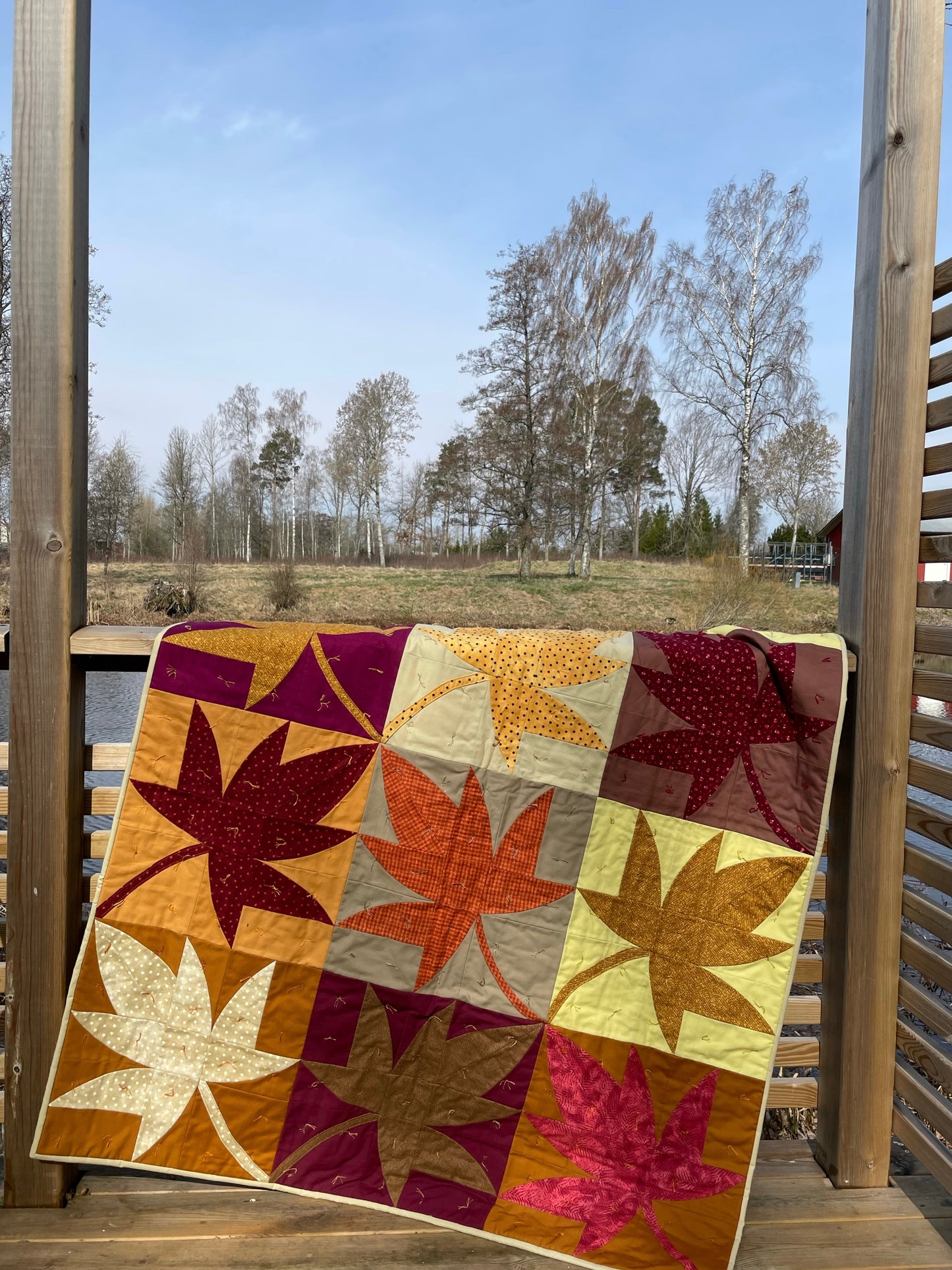 Quilt hanging on a terrace.