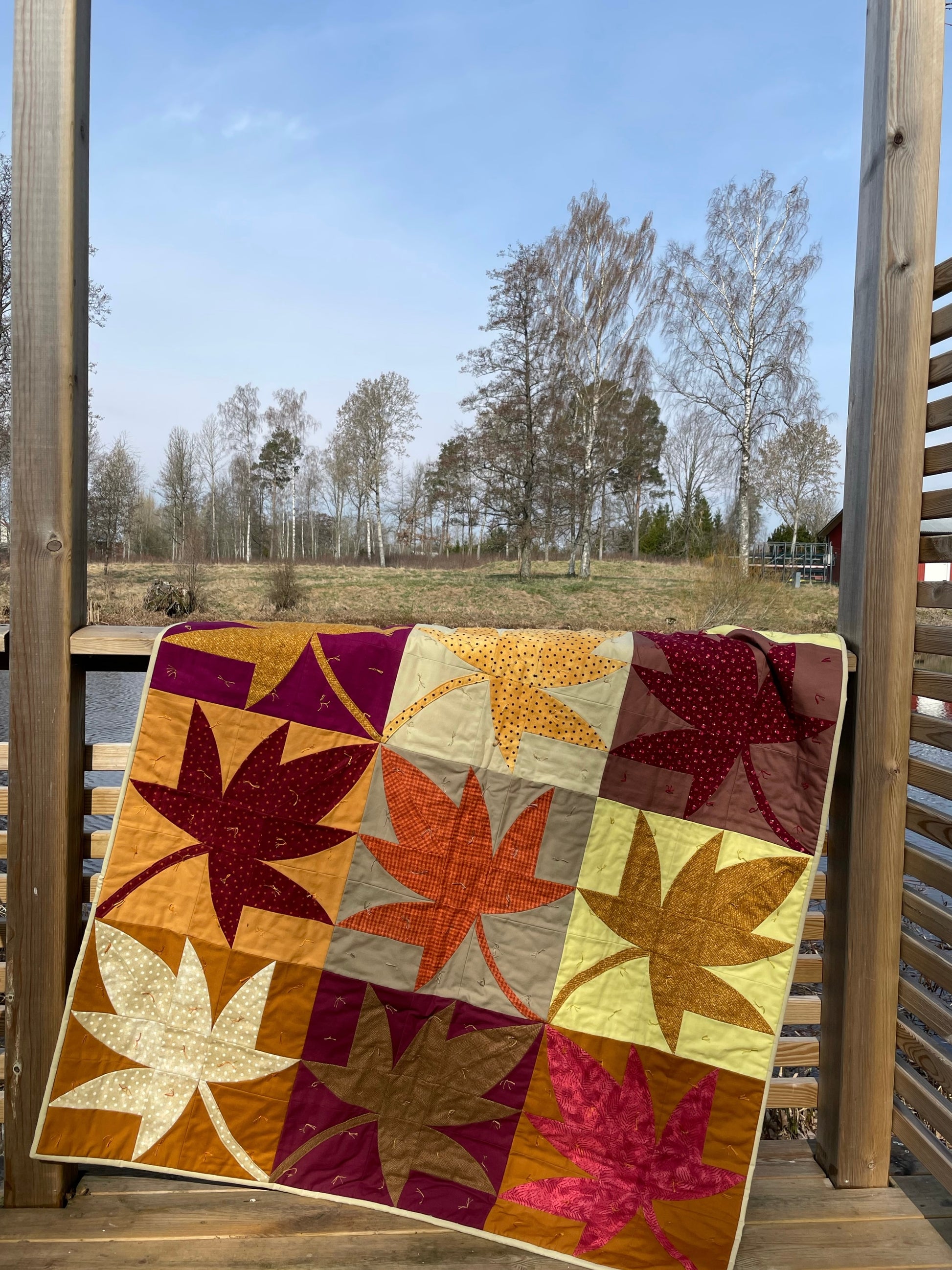 Quilt hanging on a terrace.