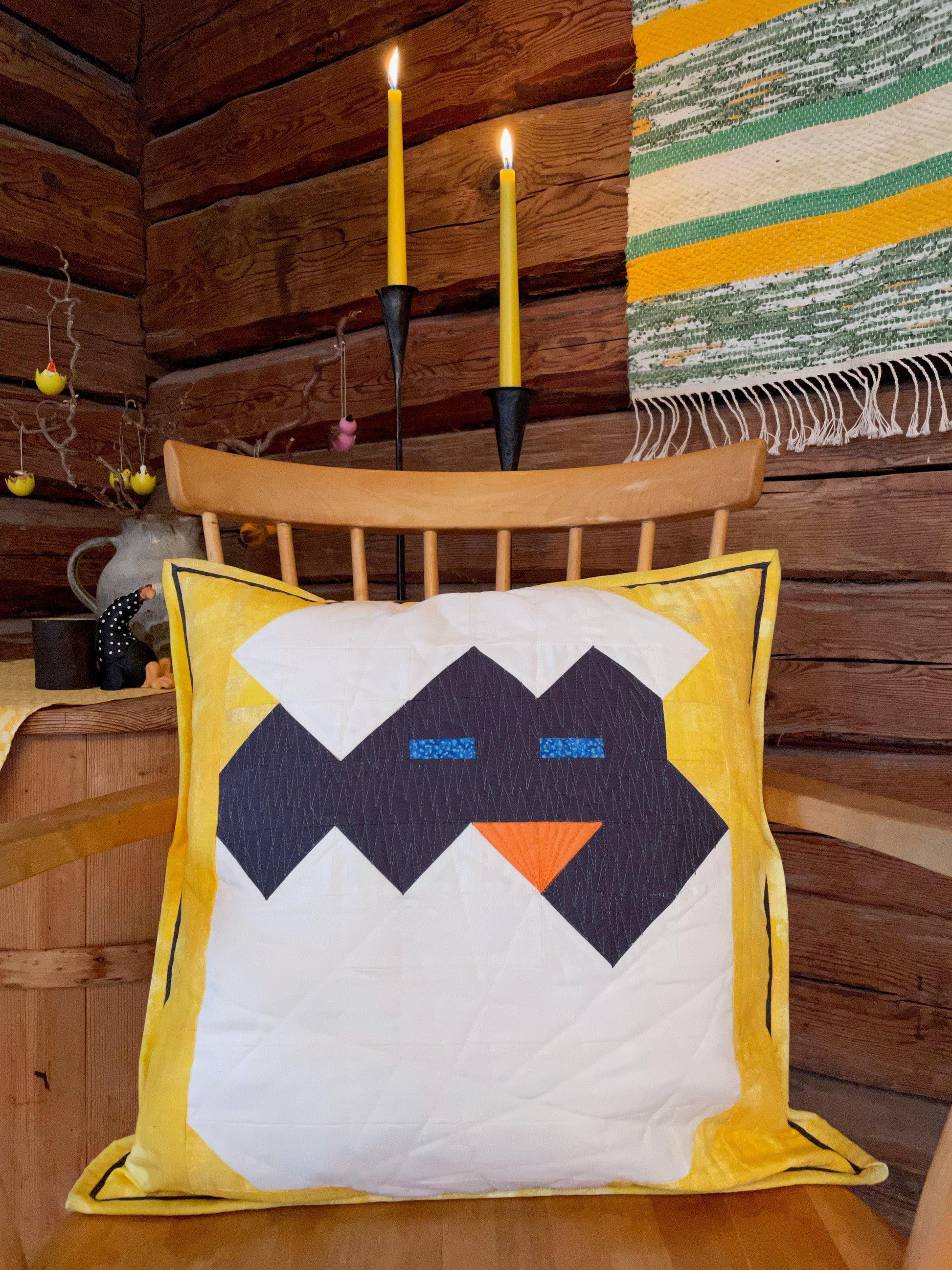 Pillow with chicken in cracked egg shell.