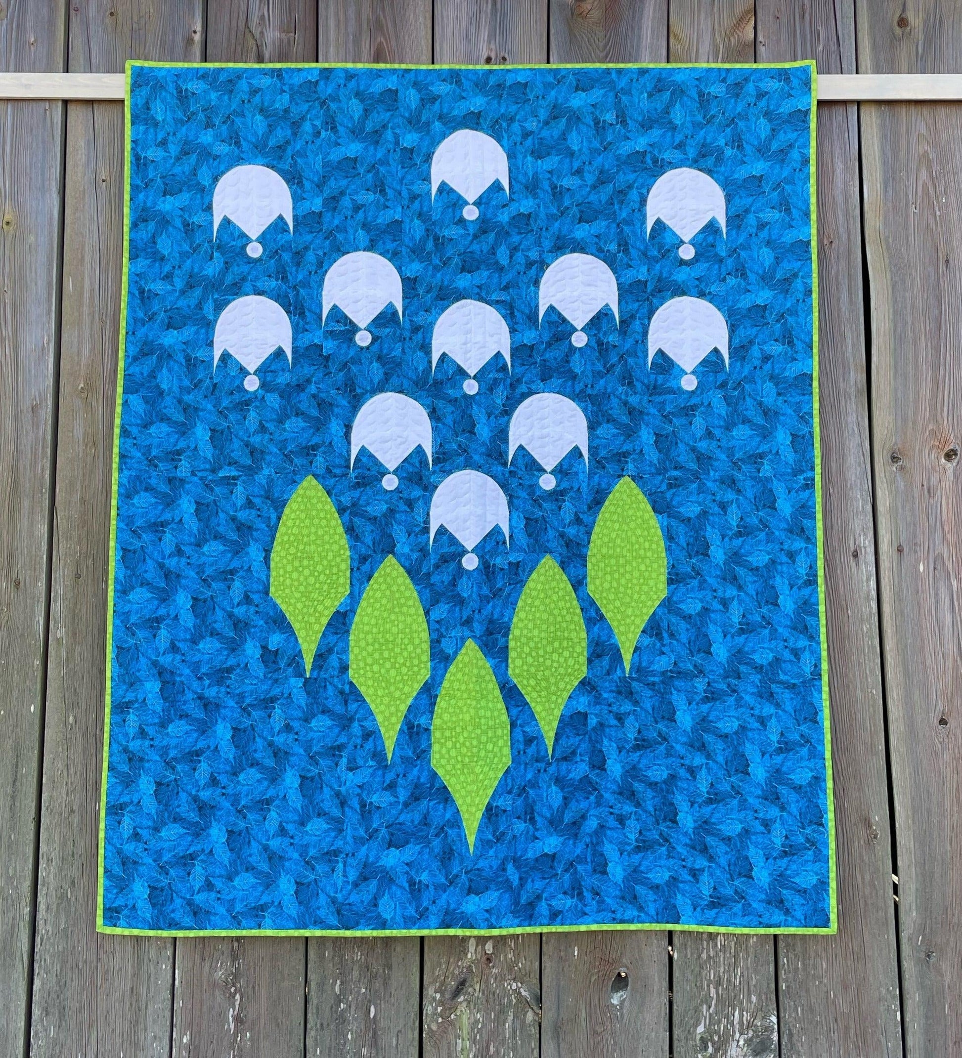 Quilt against vintage barn.