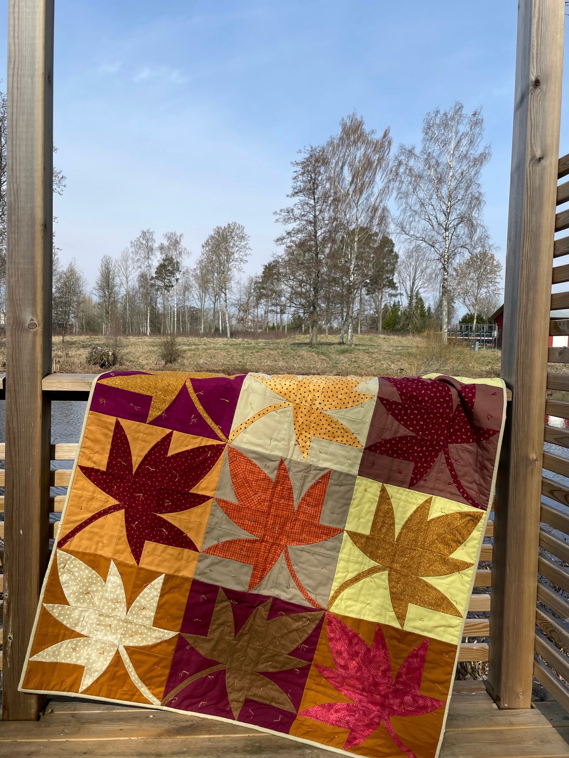 Quilt hanging on a terrace. 