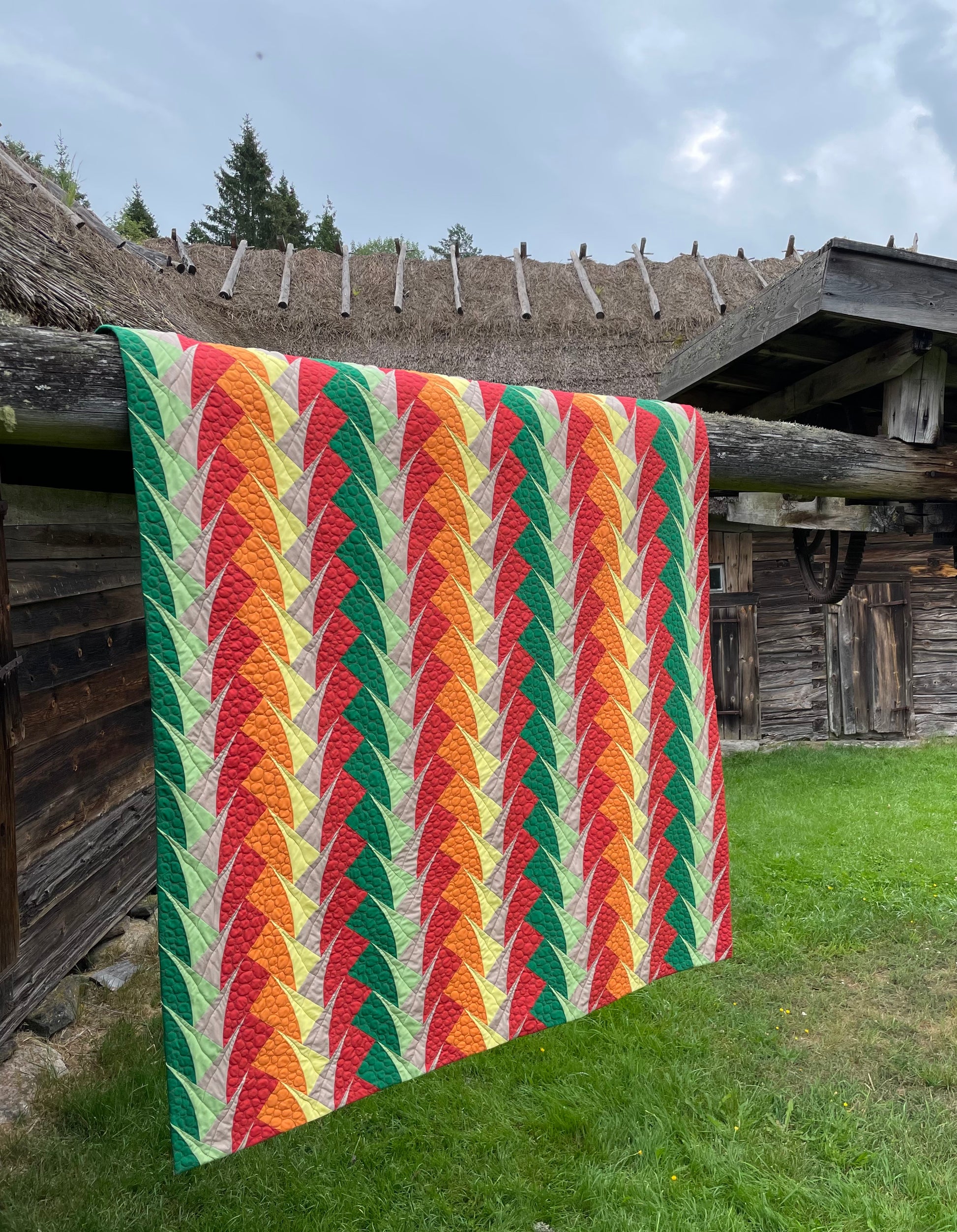 Quilt outside old farm