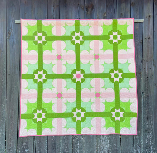 Quilt against vintage barn.