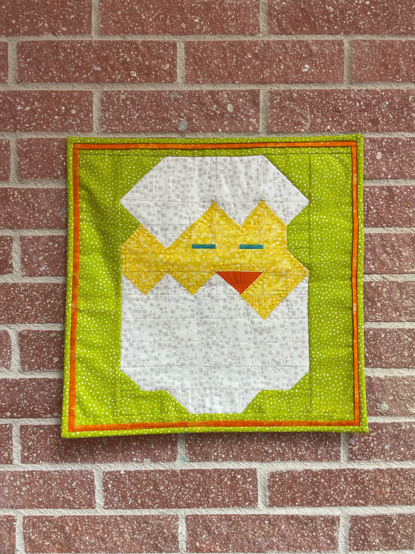 Yellow chicken as wall-hanging